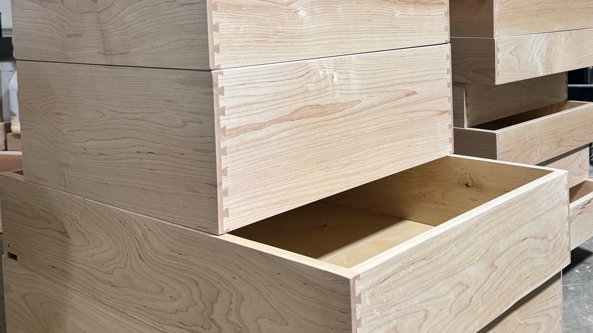 Stacked drawer boxes with dovetailed corners in the shop